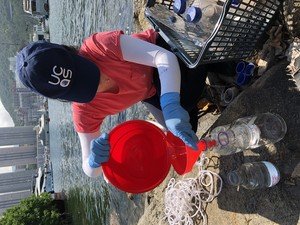 PhD student Katie Yeung was filling up the bottles with collected seawater in Aberdeen